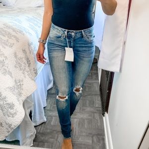 Medium wash ripped knee jeans
